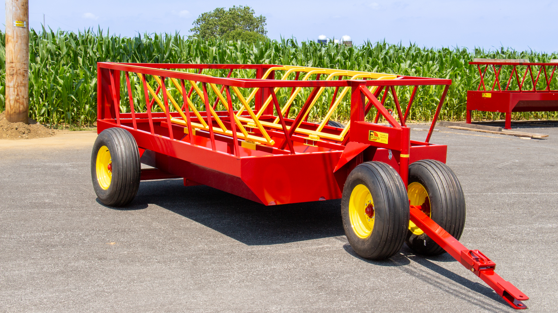 exterior photo of quality 700 drb no waste hay feeder for cattle for sale by cornfield