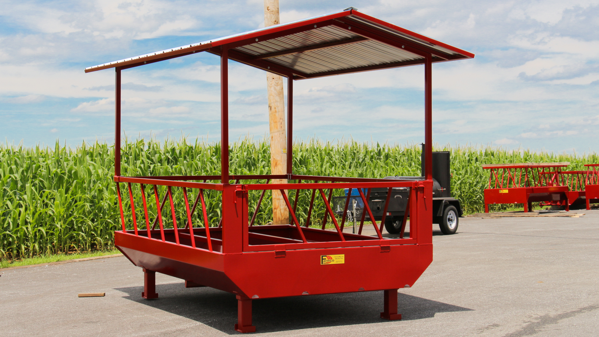 exterior photo of big red best hay feeder for cattle for sale