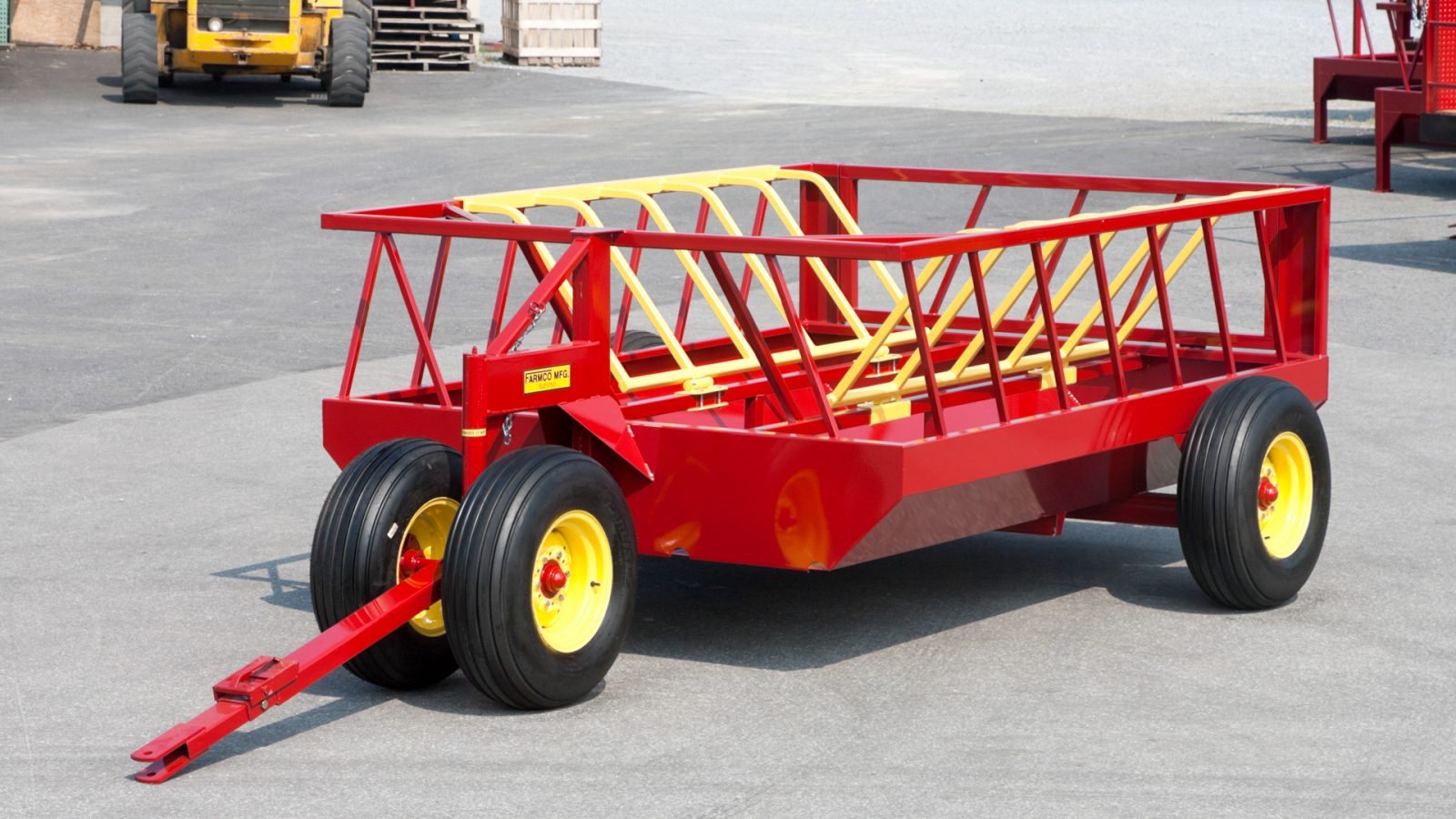 photo of red and yellow 700 drb no waste hay feeder for cattle for sale